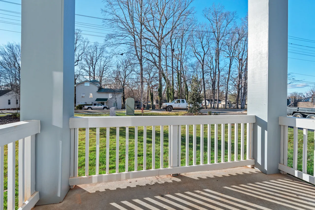 Covered porch overlooking the community lawn